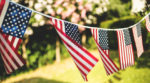 American Flags Hanging in a Backyard