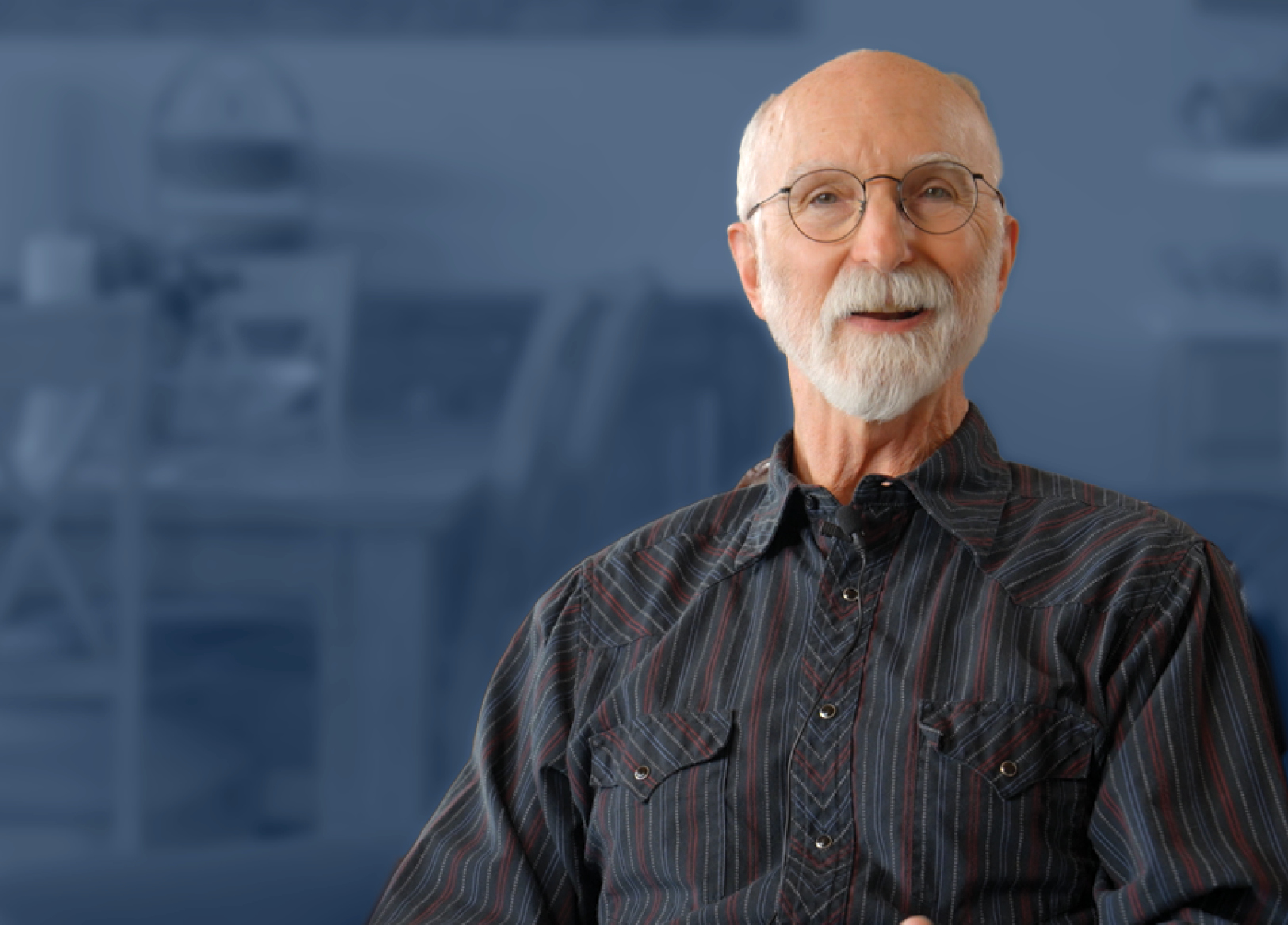 man standing in front of a blue background