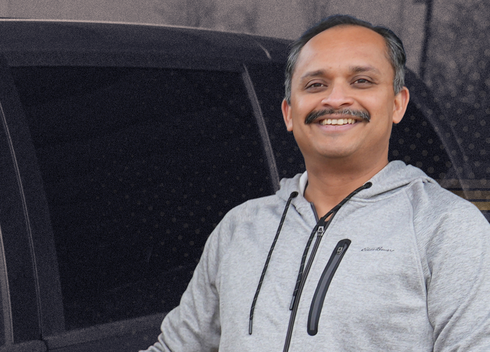 Man standing in front of a van.