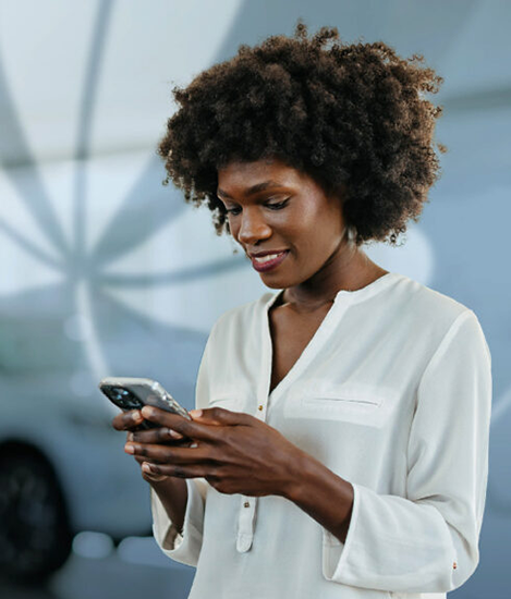 Woman in front of blue stylized background.