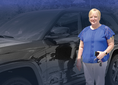 Woman in front of a van