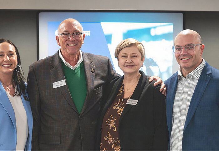 Executives from Notre Dame Federal Credit Union and United Catholic Financial Credit Union celebrating the voting for the union merger in Minnesota on March 18, 2026