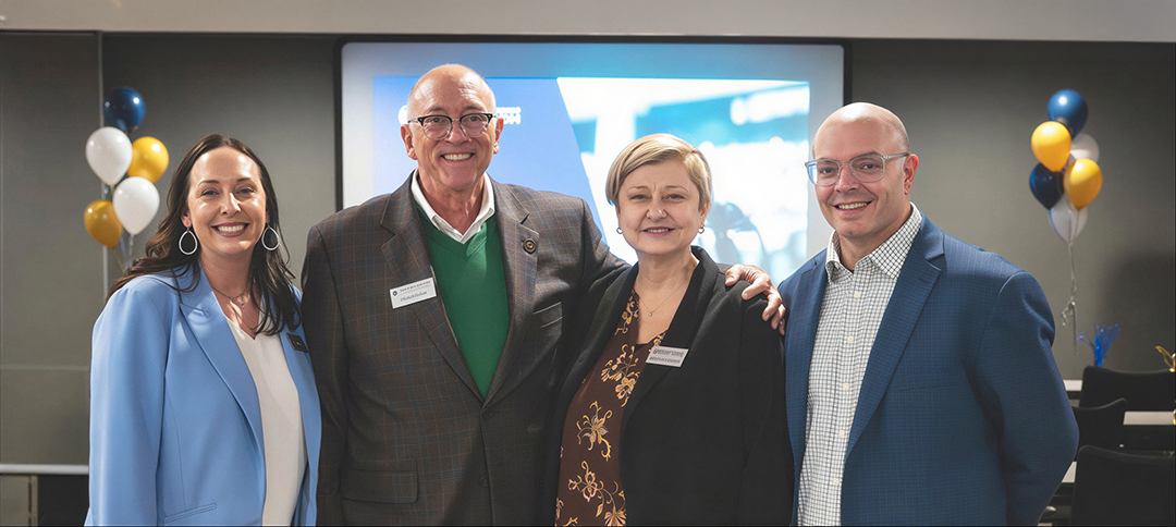 Executives from Notre Dame Federal Credit Union and United Catholic Financial Credit Union celebrating the voting for the union merger in Minnesota on March 18, 2026